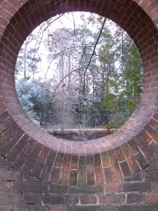 Window through the garden wall looking out to the canal. 