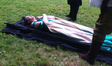 Ophelia, about to be taken to the graveyard. 