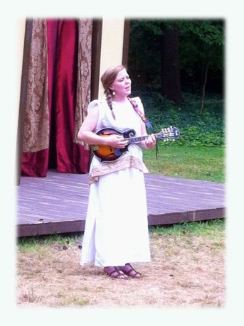 Lisa Davidson playing mandolin and singing during intermission.