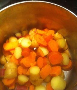 Steam rises from the cooked potatoes. (Sweet and regular)