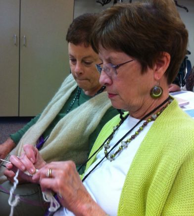 My bestest knitting buddy Sheila (front) picks up a cabling technique in our Aran class.