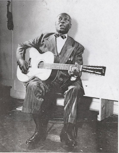 Lead Belly singing and playing the 12 string. (Image courtesy: the Lead Belly Foundation)