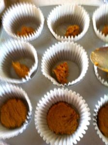 Graham Cracker Crust added to the muffin cups (top) and smashed down and ready to (bottom.)