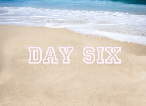 Beautiful tropical beach with the word summer written on the san